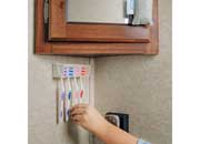 Load image into Gallery viewer, Camco A Pop-A-Toothbrush Wall Mounted - 57204
